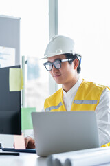 Asian engineer working at computer