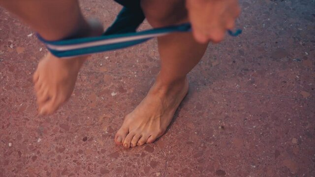 summer, vacation - young woman wears bikini bottoms and winks at the camera