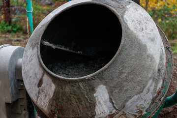 Mixing of concrete in the concrete mixer at construction site