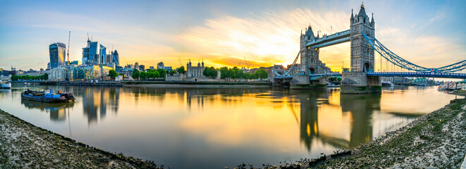 Sunrise panorama of Tower Bridge and financial district in London, England 