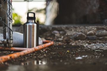 Large Stainless Steel Tumbler Jug in Grunge Punk Rock Construction Setting