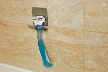 Bathroom accessories, razor shelf. Shaver Holder on the wall in the bathroom. Razor Holding Device...