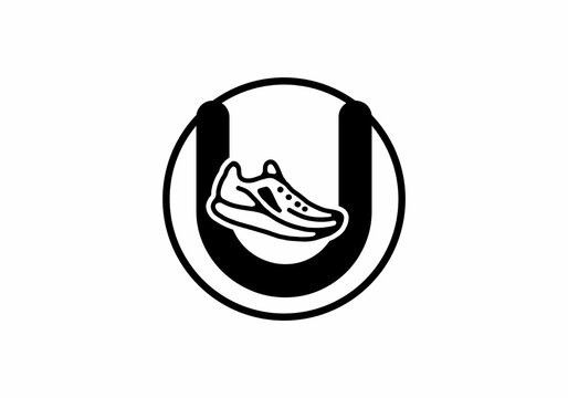 Black U initial letter with shoes in circle