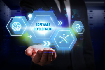 Business, Technology, Internet and network concept. Young businessman working on a virtual screen of the future and sees the inscription: Software development