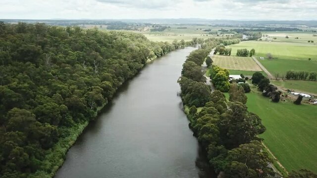 Sideways drone footage over the Snowy River between Marlo and Orbost, in Gippsland, Victoria, Australia, December 2020