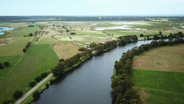 Aerial footage along the Snowy River and adjacent wetlands near Marlo, in Gippsland, Victoria, Australia, December 2020
