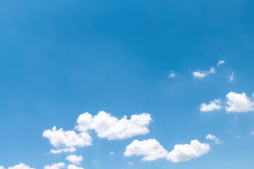 Clould with light wind on vast bright blue sky background with space