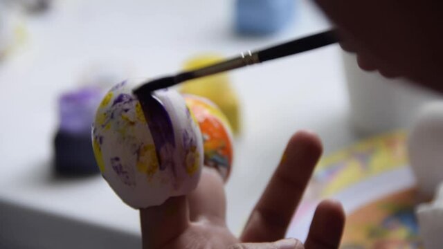 Tradition of painting Easter shells, multi-color children's task, culture and art.