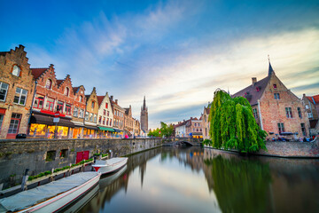 Fototapeta premium Cityscape of Bruges at sunset with Saint Salvator church tower in the background 