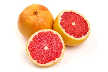 Juicy grapefruit with a half, isolated on white background. High resolution image.