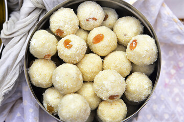 Top view of delicious Indian rava laddu sweets in a container