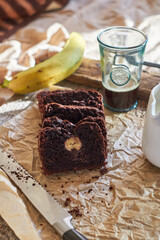 Chocolate banana bread. Side view. wooden background. Coffee.