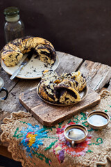 Poppy seed wreath bread. Wooden background, side view. Rustic.