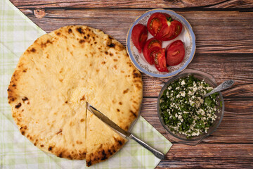 Ossetian pie, cottage cheese with herbs closeup national food