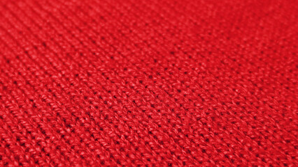 Red Knitted Wool Fabric in Diagonal Patterns with Selective Focus