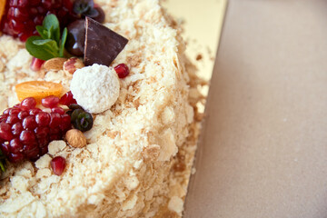 Happy birthday concept. Festive cake decorated with fruits and sweets with copy space