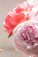 Bouquet of pink peonies in a matching pink watering can