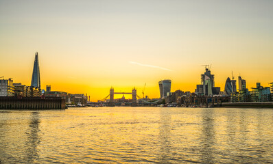 Fototapeta premium London skyline at sunset including Tower Bridge and skyscrapers at financial district