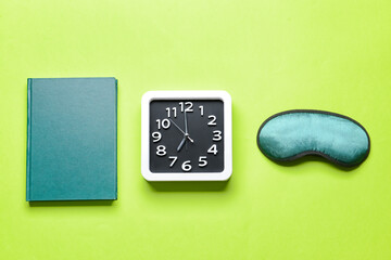 Composition with stylish clock on color background