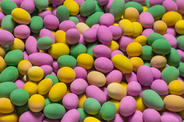 Group of colorful peanuts in glaze.