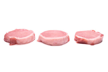 Raw pork pieces isolated on a white background.