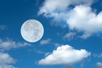 Naklejka na ściany i meble Full moon and white clouds on the sky.