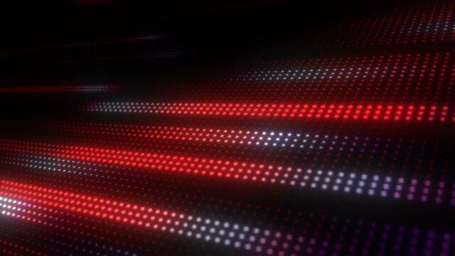 This is stock motion graphic that shows digital field of luminous red  dots racing in lines on a tilted plane.