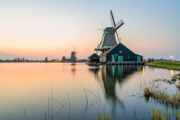 Fototapeta na wymiar Old Dutch windmill at sunset in Zaanse Schans