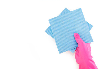 hand in a pink glove holds two blue cleaning sponges isolated on white background. Copy space.