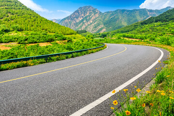 Empty asphalt road and green mountain nature landscape.Highway and mountain background.