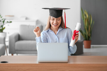 Happy female student on her graduation day at home. Concept of studying online - obrazy, fototapety, plakaty