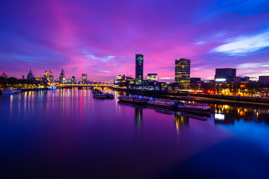 Southbank of river Thames at sunrise in London . England