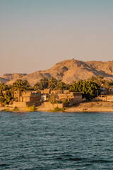 Vertical view of a traditional village at sunset on the Nile River near Edfu, Egypt