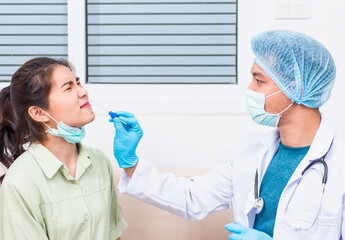 Coronavirus test, Doctor man take saliva sample through nose with cotton swab to check coronavirus...