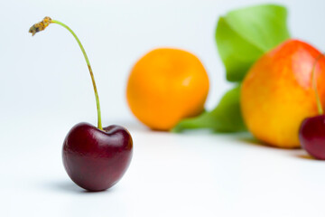 A large cherry on a white background
