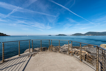 Seascape in the Gulf of La Spezia view from Lerici town, on the horizon Portovenere or Porto Venere town with Palmaria, Tino and Tinetto islands. Natural Landmark in Liguria region, Italy, Europe.