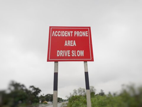 Drive slow, accident prone area sign board on the highway, roadside