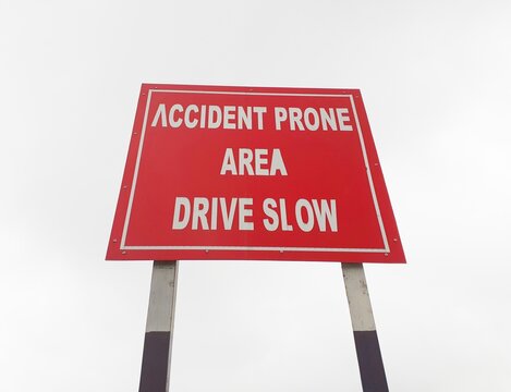 Drive Slow, Accident Prone Area Sign Board On The Highway, Roadside