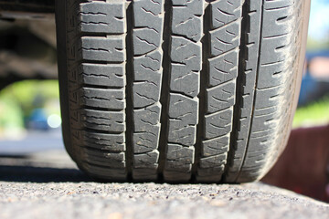 Obraz premium New pickup truck tire on the road