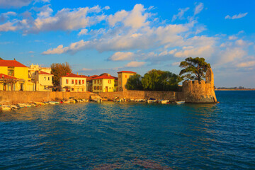 Fototapeta na wymiar Greece Nafpactos panoramic port view with Venetcia lighthouse in ports entrance, Central Greece