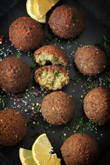 Falafels on a dark surface. Middle Eastern food. Israeli cuisine.