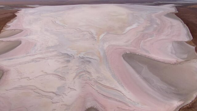 Helicopter epic salt lake dried rose bottom mystical mineral crystallized streaks pattern. Smooth steppe Russia Kalmykia natural landscape. Landmark. Open space horizon. Best planet Earth surface film