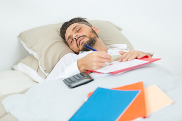 dressed in business suit man fell asleep on bed