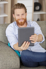 portrait of handsome manager taking a selfie on a tablet