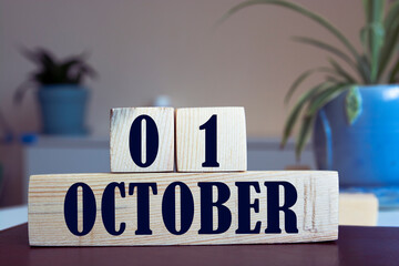 October 1st . First day, October 1 blue wooden calendar on blue abstract background. Autumn day