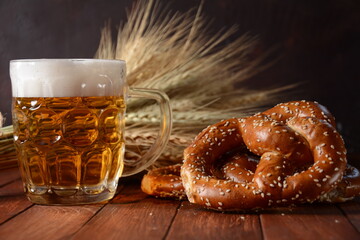 Bavarian freshly baked  homemade soft pretzel with beer. Rustic style. Oktoberfest