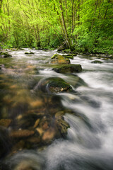 Jumping waters between large boulders in the Lor river