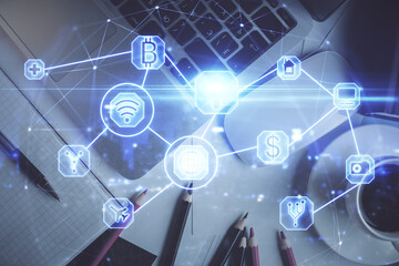 Social network hologram drawings over computer on the desktop background. Top view. Multi exposure. Concept of people connection.