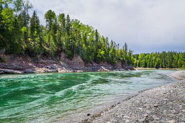 The incredibly crystal and emerald waters of the Bonaventure river at the Malin meander in Quebec,...