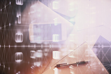 Double exposure of technology theme drawing over work table desktop. Top view. Global data analysis concept.